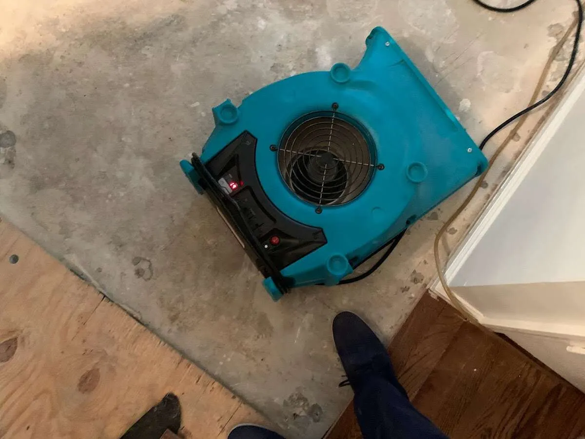 Air mover drying subfloor during Leak Detection & Repair in Lower Pottsgrove